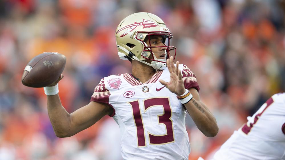 Travis helps No. 4 Florida State snap 7-game losing streak to Clemson with  31-24 overtime victory