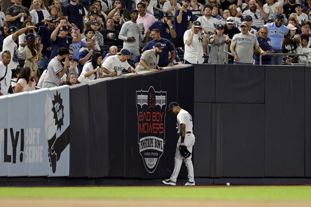 New York Yankees left fielder Aaron Hicks reacts after missing a catch on a RBI double hit by Tampa Bay Rays' Wander Franco during the fourth inning of a baseball game Friday, Sept. 9, 2022, in New York.
