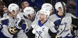 Tampa Bay Lightning center Steven Stamkos (91) celebrates with the bench after scoring against the Calgary Flames during the first period of an NHL hockey game Thursday, Nov. 17, 2022, in Tampa, Fla