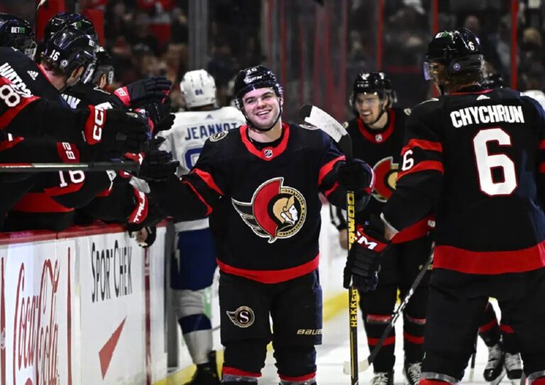 Ottawa Senators right wing Alex DeBrincat (12) celebrates after his second goal against the Tampa Bay Lightning with teammates during first-period NHL hockey game action in Ottawa, Thursday, March 23, 2023.