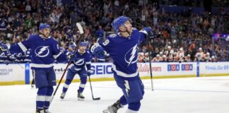 Tampa Bay Lightning's Ross Colton (79) celebrates his goal against the Philadelphia Flyers with Nicholas Paul (20) during the second period of an NHL hockey game Tuesday, March 7, 2023, in Tampa, Fla.