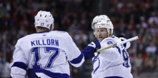 Tampa Bay Lightning center Steven Stamkos is congratulated for his goal against the New Jersey Devils by Alex Killorn (17) during the third period of an NHL hockey game Thursday, March 16, 2023, in Newark, N.J. The Lightning won 4-3 in a shootout