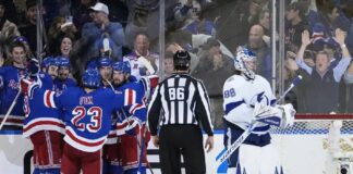 Tampa Bay Lightning goaltender Andrei Vasilevskiy (88) stands near the goal as the New York Rangers celebrate a goal by Chris Kreider during the third period of an NHL hockey game Wednesday, April 5, 2023, in New York. The Rangers won 6-3.