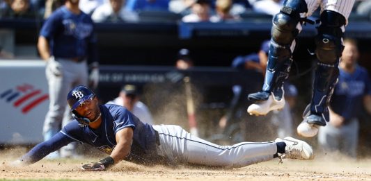 Tampa Bay Rays' Richie Palacios (1) scores against the New York Yankees in the 10th inning inning of a baseball game, Saturday, April 20, 2024 in New York. The Rays won 2-1. (AP Photo/Noah K. Murray)