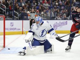 Columbus Blue Jackets forward Dmitri Voronkov, right, watches a goal by teammate Zach Werenski (not shown) get past Tampa Bay Lightning goalie Jonas Johansson, left, during the second period of an NHL hockey game in Columbus, Ohio, Thursday, Nov. 21, 2024. (AP Photo/Paul Vernon)