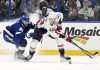 Tampa Bay Lightning defenseman Erik Cernak (81) and Washington Capitals right wing Tom Wilson battle for the puck during the second period of an NHL hockey game, Wednesday, Nov. 27, 2024, in Tampa, Fla. (AP Photo/Jason Behnken)