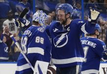 Tampa Bay Lightning defenseman Victor Hedman (77) hugs goaltender Andrei Vasilevskiy (88) after Vasilevskiy picked up his 300th career win during an NHL hockey game against the Winnipeg Jets Thursday, Nov. 14, 2024, in Tampa, Fla. (AP Photo/Chris O'Meara)