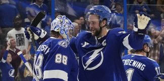 Tampa Bay Lightning defenseman Victor Hedman (77) hugs goaltender Andrei Vasilevskiy (88) after Vasilevskiy picked up his 300th career win during an NHL hockey game against the Winnipeg Jets Thursday, Nov. 14, 2024, in Tampa, Fla. (AP Photo/Chris O'Meara)