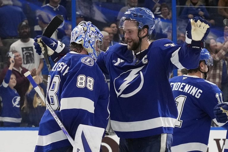 Tampa Bay Lightning defenseman Victor Hedman (77) hugs goaltender Andrei Vasilevskiy (88) after Vasilevskiy picked up his 300th career win during an NHL hockey game against the Winnipeg Jets Thursday, Nov. 14, 2024, in Tampa, Fla. (AP Photo/Chris O'Meara)