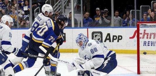 St. Louis Blues' Oskar Sundqvist (70) scores past Tampa Bay Lightning goaltender Andrei Vasilevskiy (88) during the second period of an NHL hockey game Tuesday, Nov. 5, 2024, in St. Louis. (AP Photo/Scott Kane)