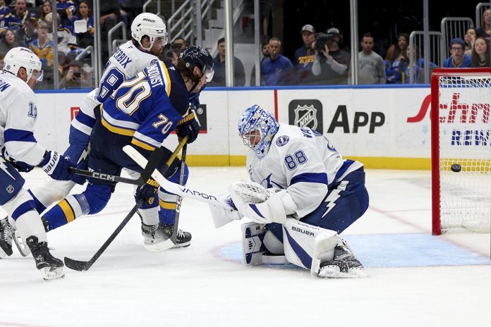 St. Louis Blues' Oskar Sundqvist (70) scores past Tampa Bay Lightning goaltender Andrei Vasilevskiy (88) during the second period of an NHL hockey game Tuesday, Nov. 5, 2024, in St. Louis. (AP Photo/Scott Kane)