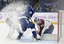 Colorado Avalanche goaltender Alexandar Georgiev (40) makes a save against Tampa Bay Lightning left wing Brandon Hagel (38) during the second period of an NHL hockey game Monday, Nov. 25, 2024, in Tampa, Fla. (AP Photo/Jason Behnken)