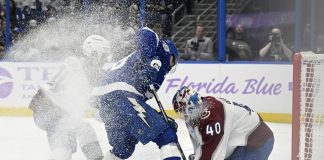 Colorado Avalanche goaltender Alexandar Georgiev (40) makes a save against Tampa Bay Lightning left wing Brandon Hagel (38) during the second period of an NHL hockey game Monday, Nov. 25, 2024, in Tampa, Fla. (AP Photo/Jason Behnken)