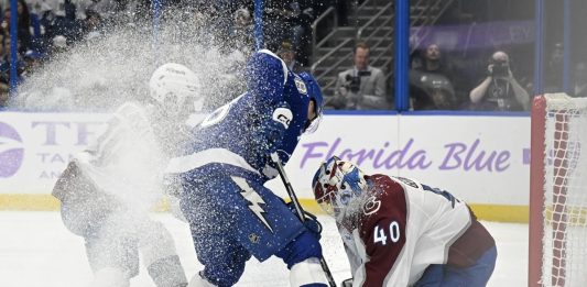 Colorado Avalanche goaltender Alexandar Georgiev (40) makes a save against Tampa Bay Lightning left wing Brandon Hagel (38) during the second period of an NHL hockey game Monday, Nov. 25, 2024, in Tampa, Fla. (AP Photo/Jason Behnken)