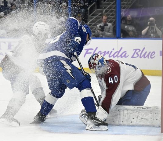 Colorado Avalanche goaltender Alexandar Georgiev (40) makes a save against Tampa Bay Lightning left wing Brandon Hagel (38) during the second period of an NHL hockey game Monday, Nov. 25, 2024, in Tampa, Fla. (AP Photo/Jason Behnken)