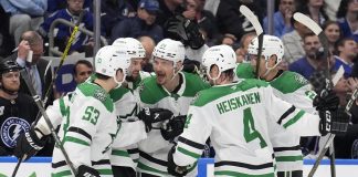 Dallas Stars center Roope Hintz (24) celebrates his goal against the Tampa Bay Lightning with center Wyatt Johnston (53) and defenseman Miro Heiskanen (4) during the third period of an NHL hockey game Saturday, Nov. 23, 2024, in Tampa, Fla. (AP Photo/Chris O'Meara)