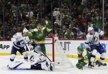 Minnesota Wild left wing Kirill Kaprizov, center left, celebrates as he scores a goal while Tampa Bay Lightning goaltender Andrei Vasilevskiy looks for the puck during the third period of an NHL hockey game, Friday, Nov. 1, 2024, in St. Paul, Minn. (AP Photo/Ellen Schmidt)