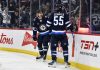 Winnipeg Jets' Mark Scheifele (55) celebrates after his goal against the Tampa Bay Lightning with teammate Gabriel Vilardi (13) during second-period NHL hockey game action in Winnipeg, Manitoba, Sunday, Nov. 3, 2024. (Fred Greenslade/The Canadian Press via AP)