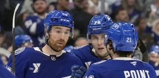 Tampa Bay Lightning defenseman Nick Perbix (48) celebrates his goal against the San Jose Sharks withn defenseman Emil Lilleberg (78) and center Brayden Point (21) during the second period of an NHL hockey game Thursday, Dec. 5, 2024, in Tampa, Fla. (AP Photo/Chris O'Meara)