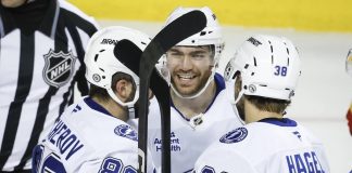 ampa Bay Lightning's Brayden Point, center, celebrates after his goal with teammates during second-period NHL hockey game action against the Calgary Flames in Calgary, Alberta, Thursday, Dec. 12, 2024. (Jeff McIntosh/The Canadian Press via AP)