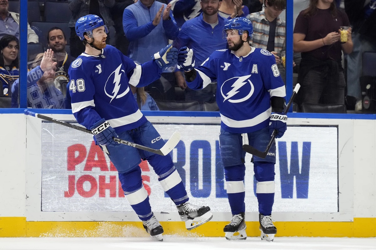 Tampa Bay Lightning defenseman Nick Perbix (48) celebrates his goal against the St. Louis Blues with right wing Nikita Kucherov (86) during the second period of an NHL hockey game Thursday, Dec. 19, 2024, in Tampa, Fla. (AP Photo/Chris O'Meara)