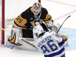 Pittsburgh Penguins goaltender Tristan Jarry (35) blocks a shot by Tampa Bay Lightning's Nikita Kucherov (86) during the first period of an NHL hockey game in Pittsburgh, Sunday, Jan. 12, 2025. (AP Photo/Gene J. Puskar)