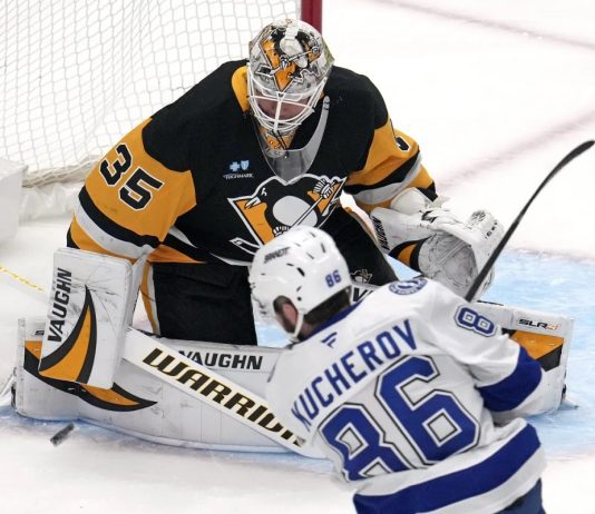 Pittsburgh Penguins goaltender Tristan Jarry (35) blocks a shot by Tampa Bay Lightning's Nikita Kucherov (86) during the first period of an NHL hockey game in Pittsburgh, Sunday, Jan. 12, 2025. (AP Photo/Gene J. Puskar)