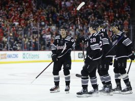 New Jersey Devils center Jack Hughes (86) celebrates with teammates after scoring a goal against the Tampa Bay Lightning during the second period of an NHL hockey game, Saturday, Jan. 11, 2025, in Newark, N.J. (AP Photo/Noah K. Murray)