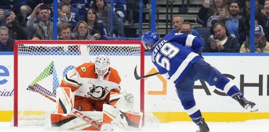 Tampa Bay Lightning center Jake Guentzel (59) scores past Anaheim Ducks goaltender Lukas Dostal (1) during a shootout in an NHL hockey game Thursday, Jan. 16, 2025, in Tampa, Fla. (AP Photo/Chris O'Meara)