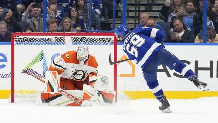 Tampa Bay Lightning center Jake Guentzel (59) scores past Anaheim Ducks goaltender Lukas Dostal (1) during a shootout in an NHL hockey game Thursday, Jan. 16, 2025, in Tampa, Fla. (AP Photo/Chris O'Meara)