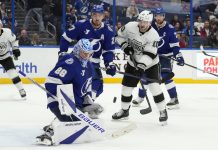 Tampa Bay Lightning goaltender Andrei Vasilevskiy (88) makes a save on a deflection by Los Angeles Kings left wing Tanner Jeannot (10) in front of defenseman Ryan McDonagh (27) during the third period of an NHL hockey game Thursday, Jan. 30, 2025, in Tampa, Fla. (AP Photo/Chris O'Meara)