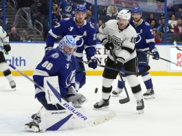 Tampa Bay Lightning goaltender Andrei Vasilevskiy (88) makes a save on a deflection by Los Angeles Kings left wing Tanner Jeannot (10) in front of defenseman Ryan McDonagh (27) during the third period of an NHL hockey game Thursday, Jan. 30, 2025, in Tampa, Fla. (AP Photo/Chris O'Meara)