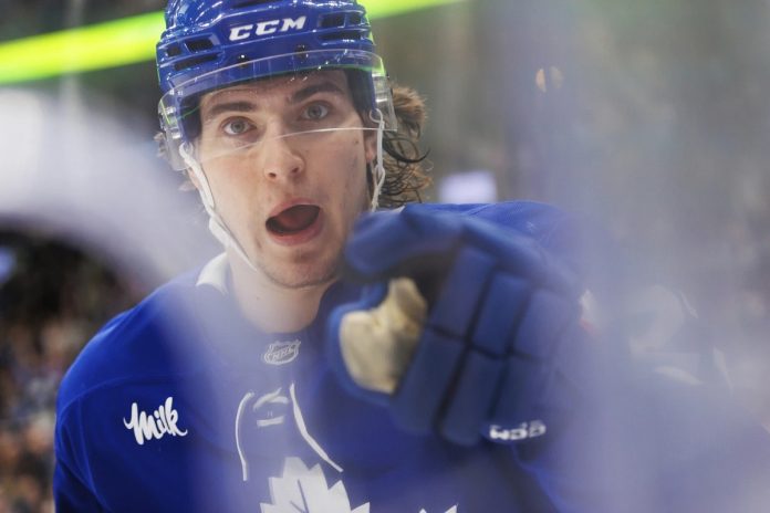 Toronto Maple Leafs' Matthew Knies celebrates a goal during the second period of an NHL hockey game against the Tampa Bay Lightning in Toronto, Monday, Jan. 20, 2025.. (Cole Burston/The Canadian Press via AP)