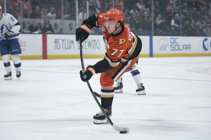 Anaheim Ducks right wing Frank Vatrano (77) shoots the puck during the first period of an NHL hockey game against the Tampa Bay Lightning, Sunday, Jan. 5, 2025, in Anaheim, Calif. (AP Photo/William Liang)