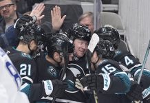 San Jose Sharks center Tyler Toffoli, center, celebrates with teammates after scoring a gaol against the Tampa Bay Lightning during the first period of an NHL hockey game in San Jose, Calif., Thursday, Jan. 2, 2025. (AP Photo/Tony Avelar)