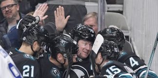 San Jose Sharks center Tyler Toffoli, center, celebrates with teammates after scoring a gaol against the Tampa Bay Lightning during the first period of an NHL hockey game in San Jose, Calif., Thursday, Jan. 2, 2025. (AP Photo/Tony Avelar)