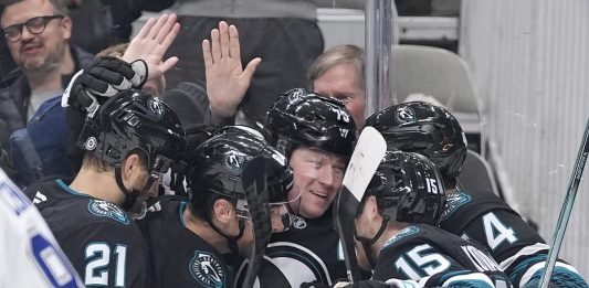 San Jose Sharks center Tyler Toffoli, center, celebrates with teammates after scoring a gaol against the Tampa Bay Lightning during the first period of an NHL hockey game in San Jose, Calif., Thursday, Jan. 2, 2025. (AP Photo/Tony Avelar)