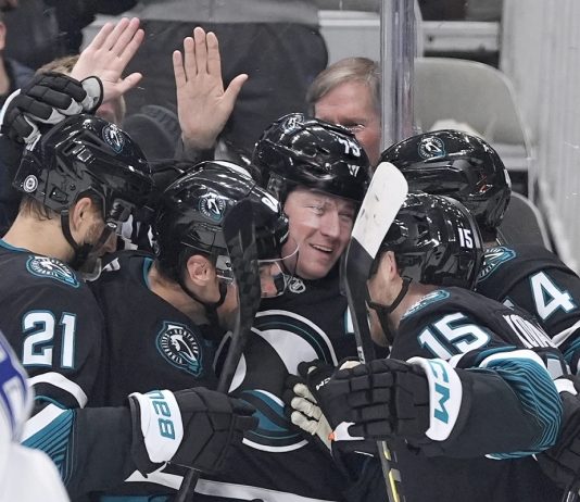 San Jose Sharks center Tyler Toffoli, center, celebrates with teammates after scoring a gaol against the Tampa Bay Lightning during the first period of an NHL hockey game in San Jose, Calif., Thursday, Jan. 2, 2025. (AP Photo/Tony Avelar)