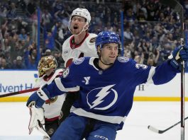 Tampa Bay Lightning left wing Brandon Hagel (38) celebrates in front of Ottawa Senators defenseman Thomas Chabot (72) after scoring past goaltender Anton Forsberg during the second period of an NHL hockey game Thursday, Feb. 6, 2025, in Tampa, Fla. (AP Photo/Chris O'Meara)