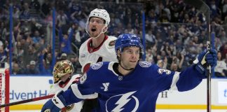 Tampa Bay Lightning left wing Brandon Hagel (38) celebrates in front of Ottawa Senators defenseman Thomas Chabot (72) after scoring past goaltender Anton Forsberg during the second period of an NHL hockey game Thursday, Feb. 6, 2025, in Tampa, Fla. (AP Photo/Chris O'Meara)