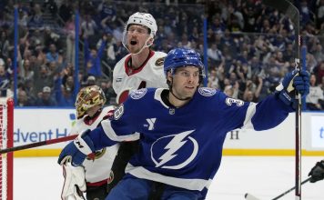 Tampa Bay Lightning left wing Brandon Hagel (38) celebrates in front of Ottawa Senators defenseman Thomas Chabot (72) after scoring past goaltender Anton Forsberg during the second period of an NHL hockey game Thursday, Feb. 6, 2025, in Tampa, Fla. (AP Photo/Chris O'Meara)