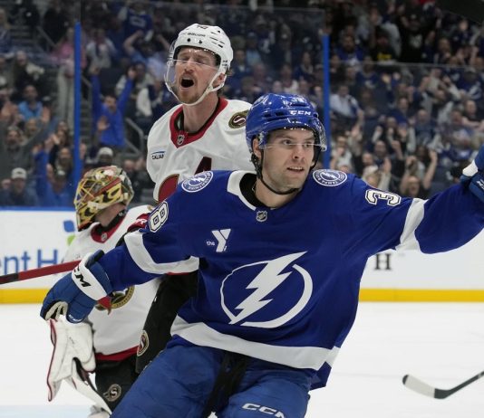 Tampa Bay Lightning left wing Brandon Hagel (38) celebrates in front of Ottawa Senators defenseman Thomas Chabot (72) after scoring past goaltender Anton Forsberg during the second period of an NHL hockey game Thursday, Feb. 6, 2025, in Tampa, Fla. (AP Photo/Chris O'Meara)