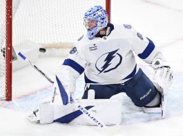 Tampa Bay Lightning goaltender Andrei Vasilevskiy is scored against by Montreal Canadiens' Brendan Gallagher during first-period NHL hockey game action in Montreal, Sunday, Feb. 9, 2025. (Graham Hughes/The Canadian Press via AP)