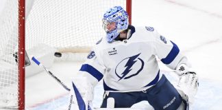 Tampa Bay Lightning goaltender Andrei Vasilevskiy is scored against by Montreal Canadiens' Brendan Gallagher during first-period NHL hockey game action in Montreal, Sunday, Feb. 9, 2025. (Graham Hughes/The Canadian Press via AP)