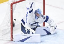 Tampa Bay Lightning goaltender Andrei Vasilevskiy is scored on by Montreal Canadiens' Jake Evans during third period NHL hockey action in Montreal, Tuesday, Jan. 21, 2025. (Graham Hughes/The Canadian Press via AP)