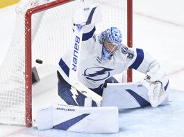 Tampa Bay Lightning goaltender Andrei Vasilevskiy is scored on by Montreal Canadiens' Jake Evans during third period NHL hockey action in Montreal, Tuesday, Jan. 21, 2025. (Graham Hughes/The Canadian Press via AP)