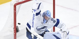 Tampa Bay Lightning goaltender Andrei Vasilevskiy is scored on by Montreal Canadiens' Jake Evans during third period NHL hockey action in Montreal, Tuesday, Jan. 21, 2025. (Graham Hughes/The Canadian Press via AP)