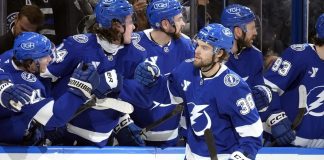 Tampa Bay Lightning left wing Brandon Hagel (38) celebrates with the bench after scoring against the Los Angeles Kings during the third period of an NHL hockey game Thursday, Jan. 30, 2025, in Tampa, Fla. (AP Photo/Chris O'Meara)