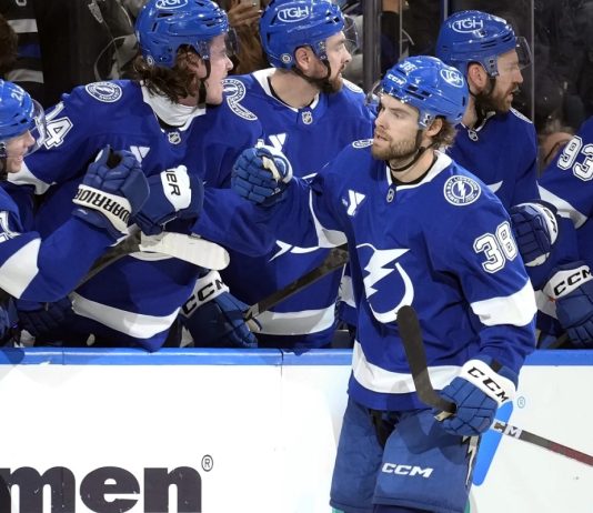 Tampa Bay Lightning left wing Brandon Hagel (38) celebrates with the bench after scoring against the Los Angeles Kings during the third period of an NHL hockey game Thursday, Jan. 30, 2025, in Tampa, Fla. (AP Photo/Chris O'Meara)