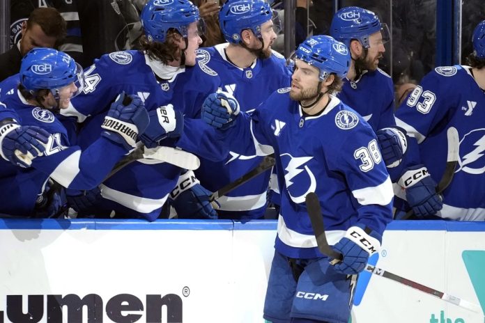 Tampa Bay Lightning left wing Brandon Hagel (38) celebrates with the bench after scoring against the Los Angeles Kings during the third period of an NHL hockey game Thursday, Jan. 30, 2025, in Tampa, Fla. (AP Photo/Chris O'Meara)